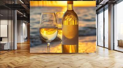 Wine bottle and glasses on the seashore at sunset Wall mural