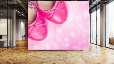 Part of pink shoes and out of focus lights Wall mural