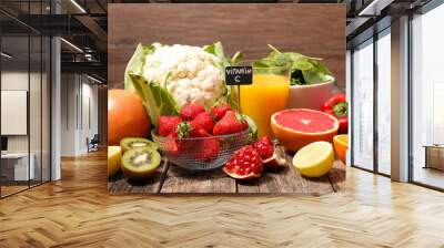 assorted of food high in vitamin c - spinach, strawberry, kiwi, orange, cauliflower Wall mural