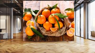 clementine and leaf on wood background Wall mural