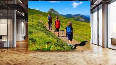 family backpacker hiking amazing mountain in France- Cantal, Auvergne, Massif Central Wall mural