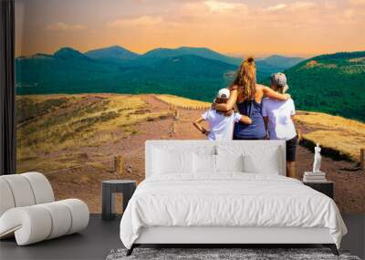 hiker family looking at beautiful view of Auvergne landscape- France,  puy de dome Wall mural