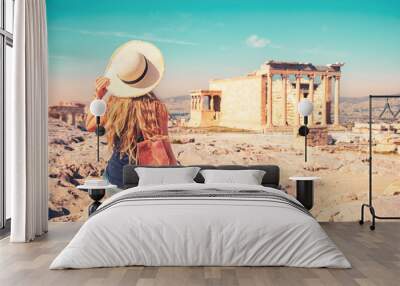 Holiday maker with hat and bag visiting famous touristic site ofAthens,  Acropolis- Travel, vacation or tour tourism in Greece- Europa Wall mural