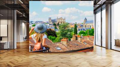 Poitiers city landscape- Woman looking at urban skyline- France Wall mural