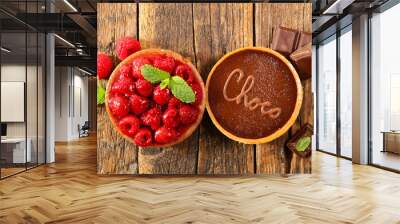 raspberry and chocolate tart on wooden table- top view Wall mural