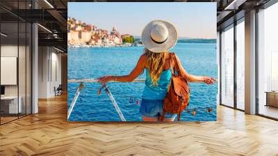 Rear view of woman tourist enjoying beautiful Sibenik village in Dalmatia- Travel, tour tourism,vacation in Croatia Wall mural