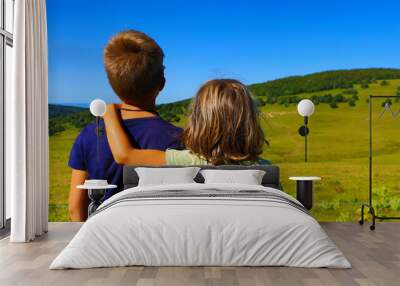 two children looking at landscape France view Wall mural