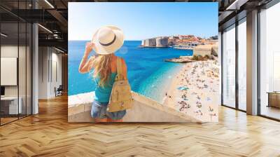 Woman tourist looking at panoramic view of Dubrovnik city and beach- Croatia Wall mural