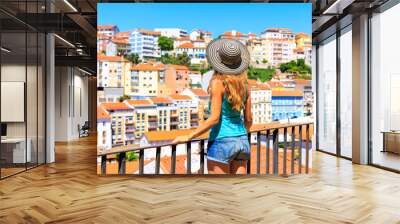 Woman tourist looking at the view of portuguese city landscape- Coimbra, Portugal Wall mural