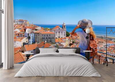 woman tourist on balcony looking at panoramic view of lisboa- tourism, vacation, travel in portugal Wall mural