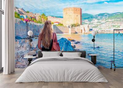 Woman travelling in Turkey, Alanya city and red tower Wall mural