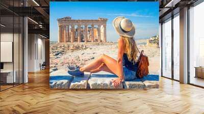 Young female tourist looking at Parthenon Athens greece temple Wall mural