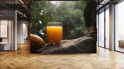 A glass of mango juice sitting on top of a rock in a forest, Generative AI Wall mural