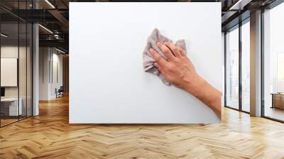 A man's hand on a white background with a rag Wall mural