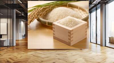 Rice in a Japanese Masu in a wooden background Wall mural