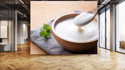 Yogurt on a wooden background Wall mural