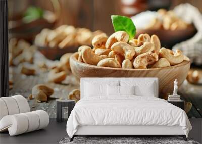 A bowl of salted cashews sits on the table Wall mural