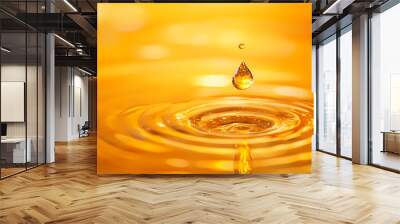 Moment of droplet in golden ripples Wall mural