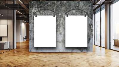 Two blank frames hanged by clothes hangers against dark dirty gray concrete wall background Wall mural