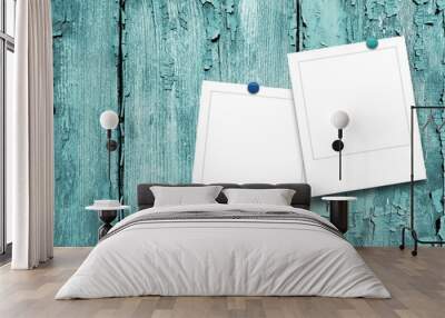 Two blank square photo frames on aqua weathered wooden background Wall mural