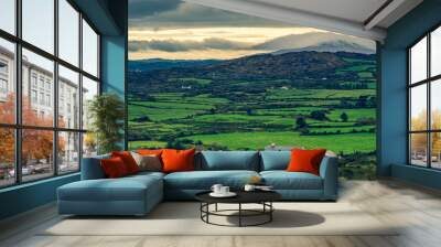 Hills of green rural fields in the countryside of Ireland. Wall mural