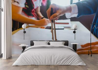 hands of a person using a compass, learning during an art class, workshop Wall mural