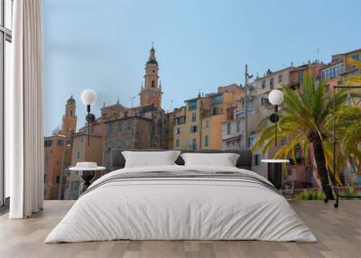 Residential buildings and church tower by the promenade. Menton, south of France.  Wall mural