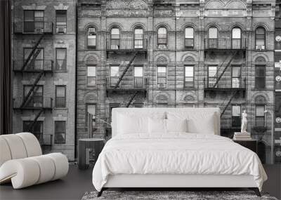 Black and white picture of old buildings with fire escapes, one of the New York City symbols, USA. Wall mural