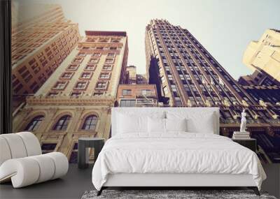 Looking up at old Manhattan buildings against the sun, color toned picture, New York City, USA. Wall mural