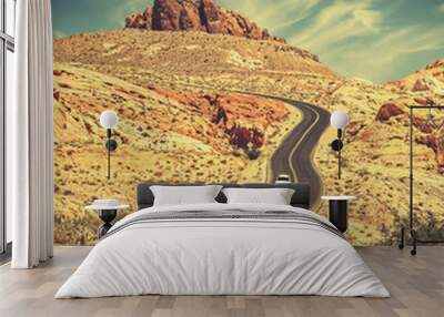 Retro toned curved desert highway, travel adventure concept, USA Wall mural