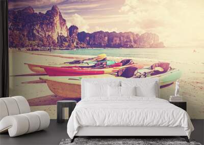 Retro toned kayaks on a tropical beach, Railay Beach, Thailand. Wall mural