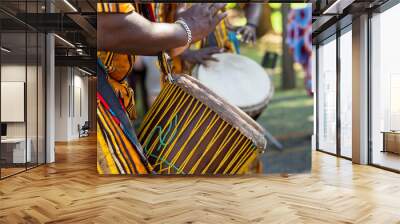 african man's hands playing the african drum. musical culture. Wall mural