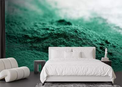 A heap of green spirulina algae powder, closeup Wall mural