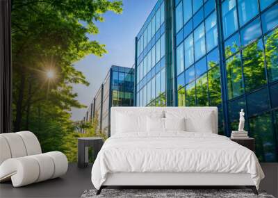 Exterior of corporate office building made of glass and steel with green trees in the street Wall mural