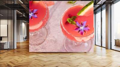 Watermelon juice decoreated with fresh borage plant Wall mural