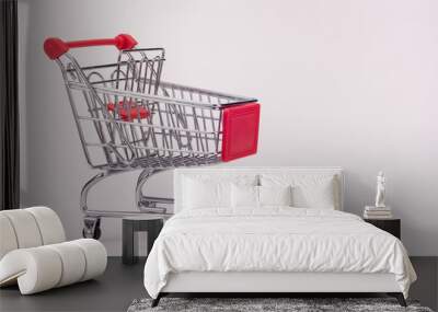 An empty grocery cart with expansion shelf on white background Wall mural