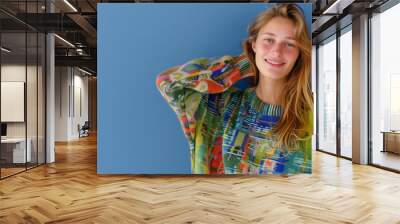 Young happy fashion model posing isolated Wall mural