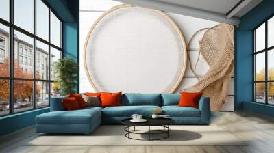 Flat lay composition with embroidery hoop and thread on white wooden background Wall mural