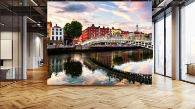 Night view of famous illuminated Ha Penny Bridge in Dublin, Ireland at sunset Wall mural