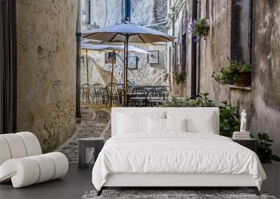 Typical street in the city of erice with its restaurant Wall mural