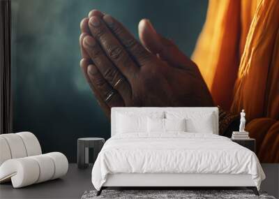 A close-up shot capturing a man's hands in deep prayer under soft light 2 Wall mural