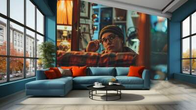 A woman trying on glasses in a vintage-inspired boutique, with retro furniture and antique decor Wall mural