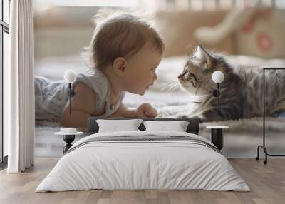 Adorable moment of a baby's first encounter with a pet Wall mural