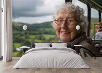 An elderly woman smiling as she boards a bus for a group tour to historic landmarks and scenic wonders with a picturesque countryside background Wall mural