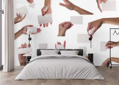 Collection of card blanks in a hand on white background Wall mural