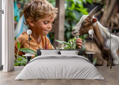 Boy feeding a goat in rustic farm setting Wall mural