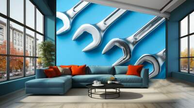 Neatly arranged spanners on blue background Wall mural