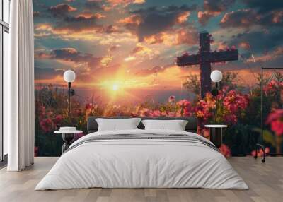 Sun rising behind a wooden cross adorned with fresh spring flowers. Easter morning. Wall mural