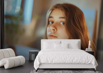 Thoughtful teenage girl in a cozy room with morning light Wall mural