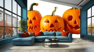 Three carved jack-o-lantern pumpkins with spooky expressions on gray background, cut out - stock png Wall mural